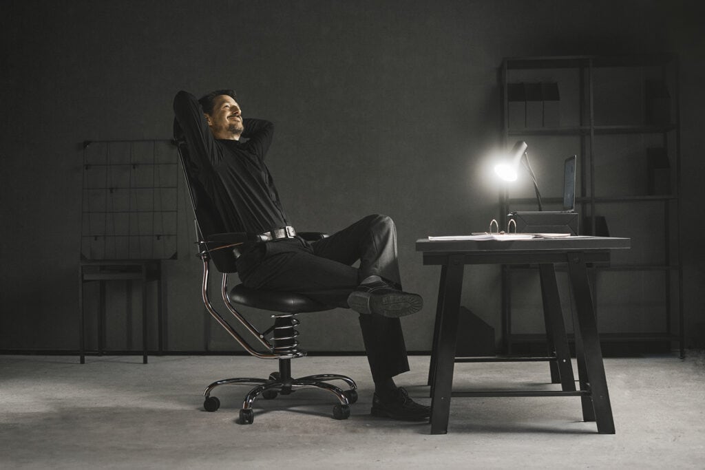 A relaxed man in a Pilot office chair